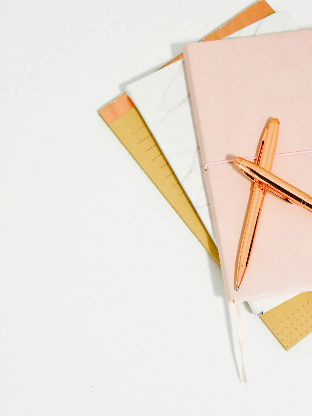 A writing desk with a notebook and pen